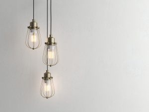 Three vintage lamps hanging from the ceiling with wall 3D renderind